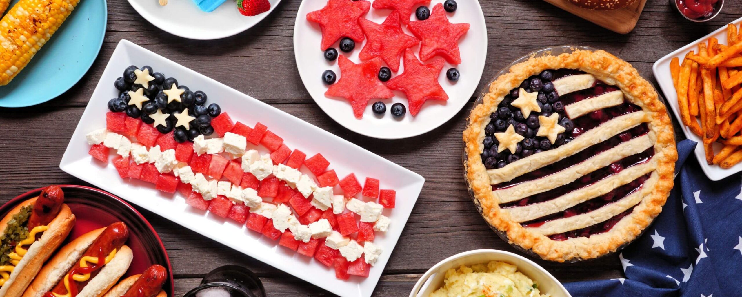 Fourth of July celebration with food that is presented like the American flag