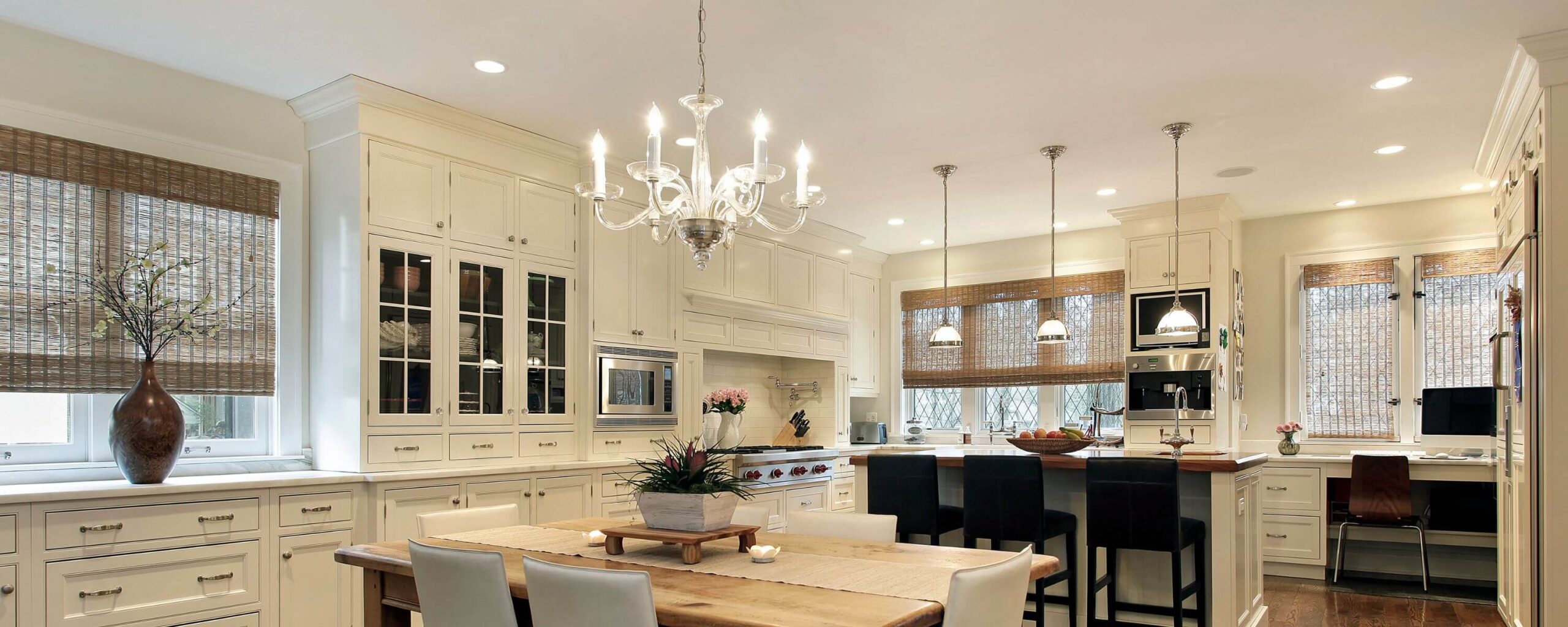 A beautiful white kitchen with marble countertops