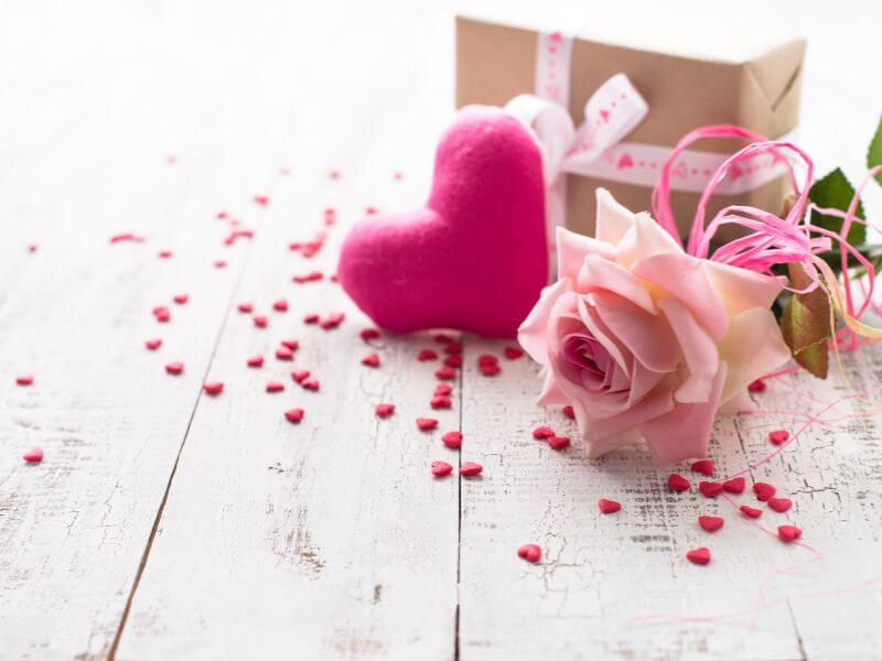 Pink heart and roses and a gift for Valentine’s Day