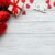 What is the point of Valentine’s Day - a picture of red roses on a white table with the word love next to it
