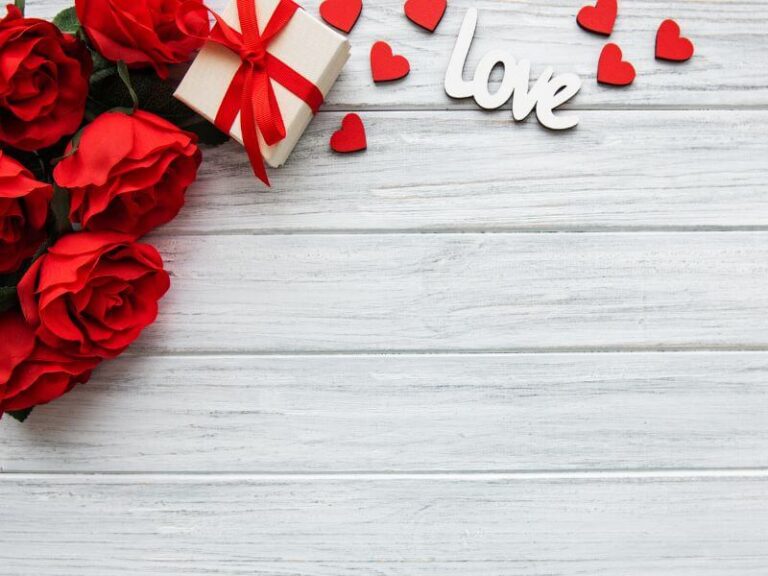 What is the point of Valentine’s Day - a picture of red roses on a white table with the word love next to it