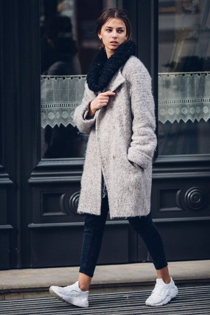 Winter Style - an elegant woman wearing oversized jacket and skinny jeans