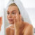 7 Days Glowing Skin Challenge: A woman putting moisturizer on her skin