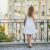 Perfection is the Enemy of Progress: A woman standing on a balcony looking out